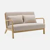 A beige two-seater sofa with wooden arms and legs, shown against a plain light gray background. Anteprima dell’immagine prodotto