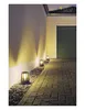 Outdoor pathway illuminated by bollard lights next to a wall and a garage door. Produktbild-Vorschau