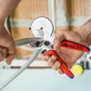 A person is using a pipe cutter to cut a pipe. Produktbild-Vorschau