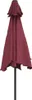 A closed bordeaux red umbrella on a black pole against a white background. Produktbild-Vorschau