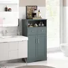 A bathroom vanity and storage cabinet are shown in a well-lit bathroom. Náhled obrázku produktu