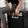 A person playing a guitar connected to a Marshall amplifier. Náhľad obrázku produktu