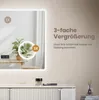 A mirror with integrated lighting and magnification features, displayed on a vanity with makeup and a diffuser. Náhľad obrázku produktu