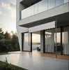 A modern house with a patio and an awning extended, during sunset. Náhled obrázku produktu