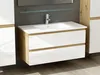A modern bathroom vanity with a white countertop and sink, featuring two white high-gloss drawers with wood accents. The vanity is mounted on the wall against a dark gray tiled wall, with a glass shelf above. Produktbild-Vorschau