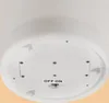 The bottom of a white product with a battery compartment and an on/off switch. Produktbild-Vorschau