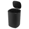 A black automatic trash can with its lid open, shown from a slightly elevated side angle against a white background. Podgląd zdjęcia produktu