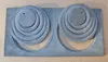 A top-down view of two sets of cast iron stove rings on a flat surface. Anteprima dell’immagine prodotto