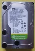 A close-up, top-down view of a Western Digital hard drive with a yellow background. Produktbild-Vorschau