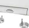 A close-up view of a white toilet seat with a silver button and two silver mounting fixtures. Anteprima dell’immagine prodotto
