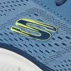 A close-up of a blue sneaker with a yellow and blue SKECHERS logo. Voir les images du produit