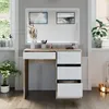 A vanity table with drawers and a mirror, set in a room with windows and plants. Náhled obrázku produktu