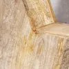 A close-up view of a wooden star decoration, showing the grain and texture of the wood. Produktbild-Vorschau