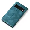 A teal flip case for a Google Pixel 6a phone, shown from the back with the camera cutout visible. Produktbild-Vorschau