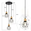 A diagram showing the dimensions of a pendant light fixture with multiple lamps. Voir les images du produit