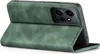 A green flip case for a smartphone is shown from the side, with the front cover open. Produktbild-Vorschau