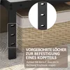 Close-up of a black metal bed frame leg with pre-drilled holes, with text overlay explaining its purpose. Produktbild-Vorschau