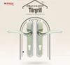 A product image featuring two door handles with a decorative background and text. Produktbild-Vorschau