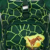 Close-up of a green backpack with a yellow geometric pattern and a dinosaur patch. Produktbild-Vorschau