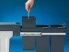 A hand is shown inserting a bin into a pull-out trash system. Produktbild-Vorschau