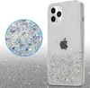A clear shot of a phone case with glitter inside, placed on a sparkly background. Náhľad obrázku produktu