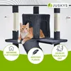 A cat is lying on a multi-level cat tree with various features highlighted by circular graphics. Náhľad obrázku produktu