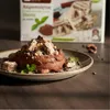 Kandylas Halva Kakao Stevia 400 g Stückchen auf Schokomousse mit Steviablatt Produktbild-Vorschau
