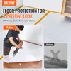 A man is laying down floor protection material in a room, with a 'before' image showing a damaged floor. Anteprima dell’immagine prodotto