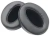 Two black ear pads for headphones are shown against a white background. Voir les images du produit