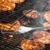 Burgers are being grilled on a barbecue. Anteprima dell’immagine prodotto