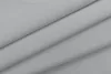 A close-up, angled view of folded gray fabric, likely a curtain or textile. Produktbild-Vorschau