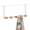 A white over-the-door hook rack with five wooden pegs, one of which is holding a scarf. Náhľad obrázku produktu