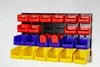 A wall-mounted storage system with multiple bins of different colors. Produktbild-Vorschau