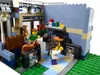 A Lego set depicting a pet shop interior with people, animals, and various pet-related items. Náhled obrázku produktu