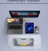 A keyboard, laptop, tablet, and smartphone are displayed together, connected to a monitor, showcasing multi-device connectivity. Produktbild-Vorschau