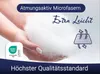 Hands holding fluffy white material with marketing text and logos. Produktbild-Vorschau