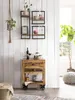 A rustic wooden cabinet with drawers and shelves, decorated with various items, stands against a white wooden wall. Produktbild-Vorschau