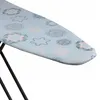 A close-up, angled view of a blue ironing board with a patterned cover. Produktbild-Vorschau