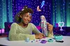 A young girl is playing with a doll in a room decorated with neon lights and starry lights. Náhľad obrázku produktu