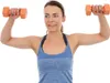 A woman is exercising with dumbbells. Náhľad obrázku produktu
