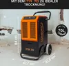 A dehumidifier is shown in a room with damaged walls, suggesting its use in restoration or drying applications. Produktbild-Vorschau