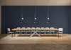 A long dining table with chairs in a room with a dark blue wall. Anteprima dell’immagine prodotto