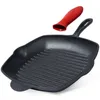 A black cast iron grill pan with a red silicone handle cover is shown against a white background. Produktbild-Vorschau