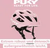 A pink Puky bicycle helmet is shown against a pink background, with marketing text at the top and bottom. Anteprima dell’immagine prodotto