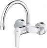 A chrome faucet with a curved spout and a single lever handle, mounted on a white background. Anteprima dell’immagine prodotto