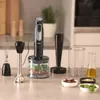 A kitchen counter with a hand blender set and ingredients. Produktbild-Vorschau