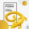 A 3D printed dragon figure is displayed against a white and light gray speckled background, with text and circular graphic elements. Produktbild-Vorschau