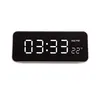 A digital clock displaying the time and temperature. Anteprima dell’immagine prodotto