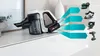 A cordless vacuum cleaner is shown on a white surface, with several power tools depicted to its right, connected by blue arrow-like graphics. Produktbild-Vorschau