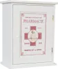 A white wooden medicine cabinet with a vintage-style pharmacy label on the door. Produktbild-Vorschau